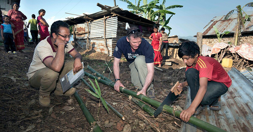 People sawing wood in Nepal