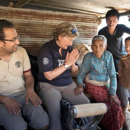Shelterbox relief team with a family in Nepal