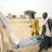 People carrying shelter kits in Chad