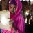 Young woman from Somaliland holds a solar light