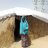 Woman outside her shelter in Nigeria
