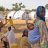 Woman with a baby in her back, in a camp in Niger