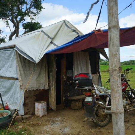 Motorcycle in front of makeshift shelter