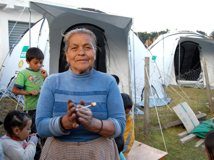 woman in front of a tent in Guatemala