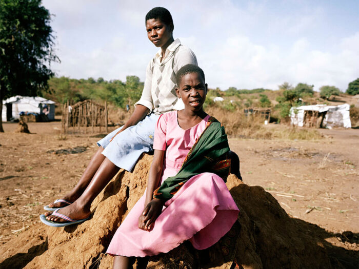 malawi children sitting on rock