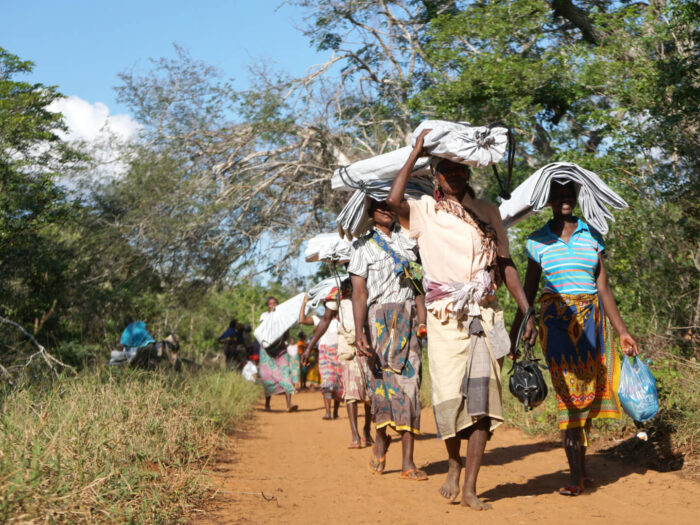 women carrying aid in Mozambique