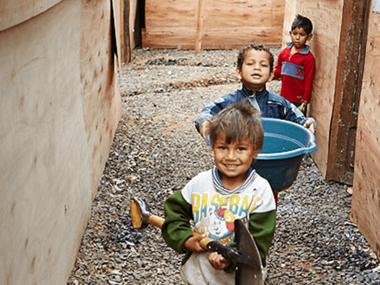 Paraguay children with shovel