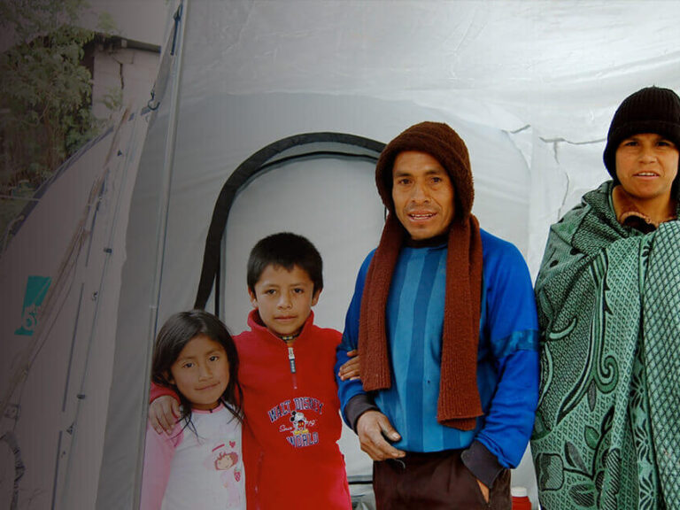 People standing in front of ShelterBox tent - Guatemala