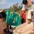 People lifting ShelterBox