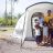 Family stand outside their tent in Legazpi Philippines following Typhoon Albay 2014