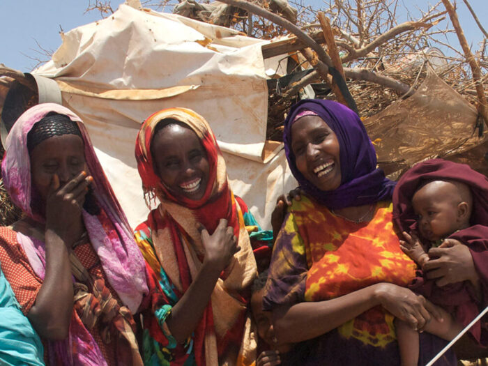 Ethiopian women standing outside a ShelterBox tent