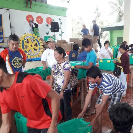 ShelterBox aid being carried by Rotary volunteers in the Philippines