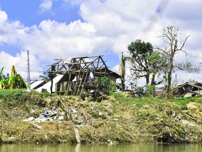 severely damaged house by the water in the Philippines after Typhoon Vongfong (Ambo)