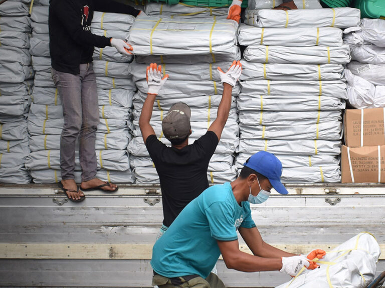 unloading shelterbox aid in the philippines during coronavirus
