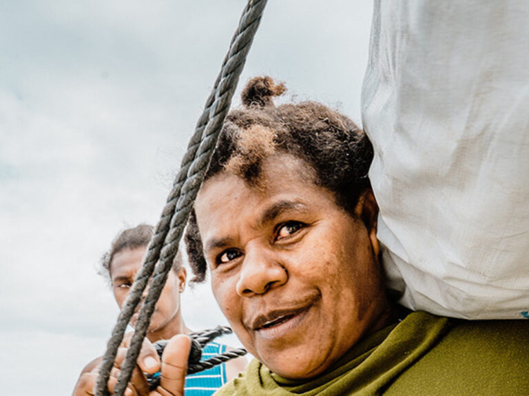 woman receiving ShelterBox shelter kit in Vanuatu after Cyclone Harold