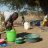young woman washing dishes in malawi