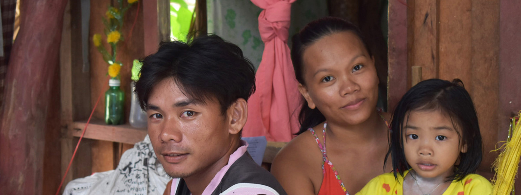 A family in their home in the Philippines