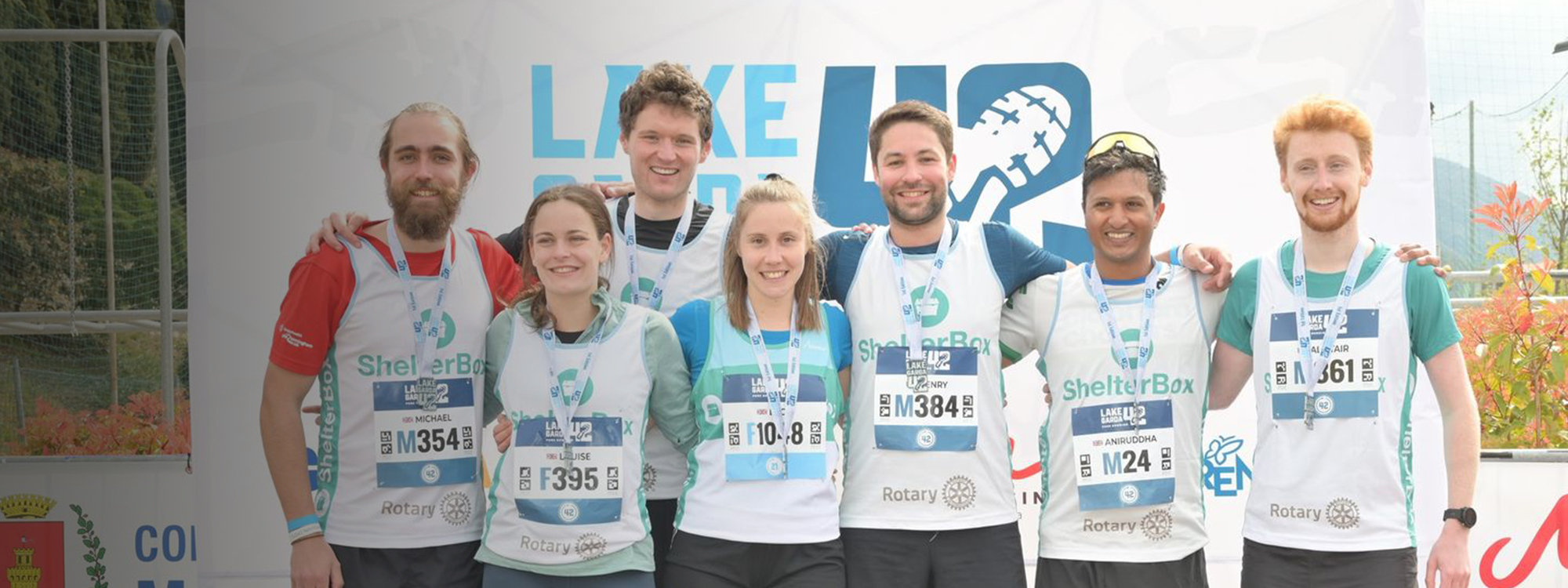 A group of people posing before running a marathon