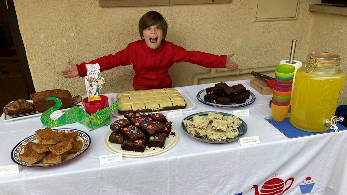 Boy with baked goods he made and sold as charity fundraising