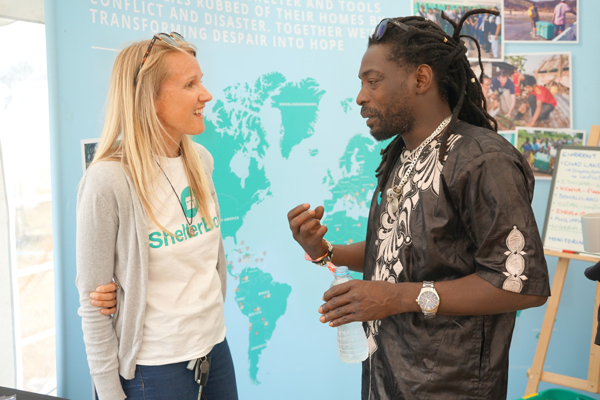 A woman and a man talking at a ShelterBox event