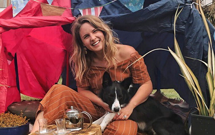 Woman and her dog by a tent
