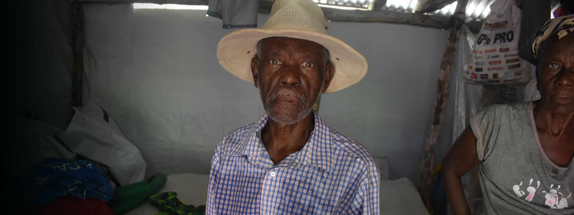 man wearing a hat in Haiti after the 2021 earthquake