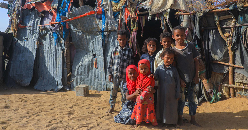 Children outside a temporary shelter in Yemen