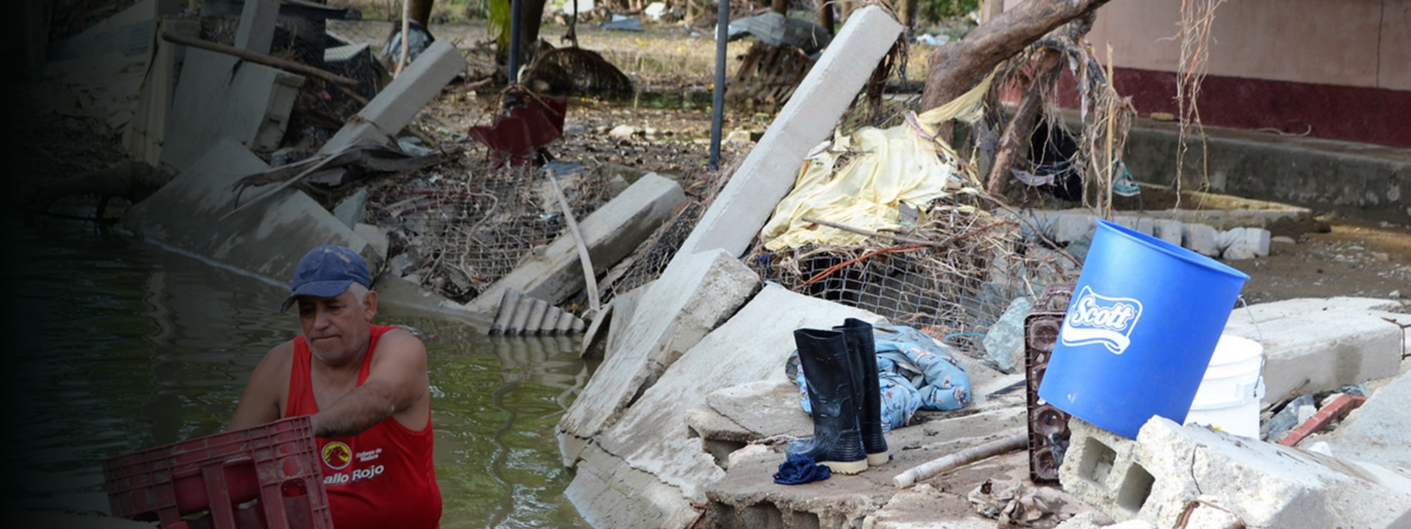 Man trying to salvage possessions from flood