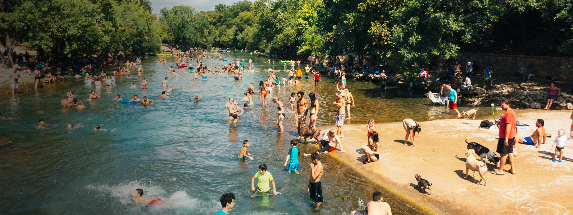 People bathing outdoors during a heatwave