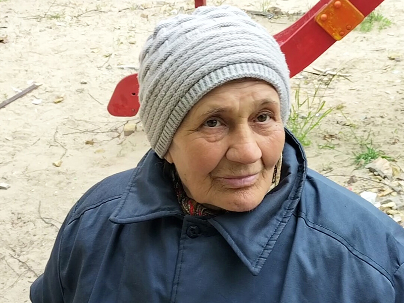 A woman wearing a winter coat and a beanie.