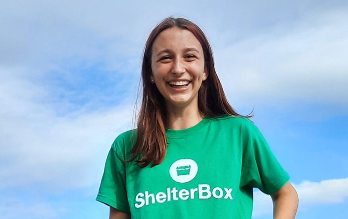 Teenage girl wearing a ShelterBox t-shirt