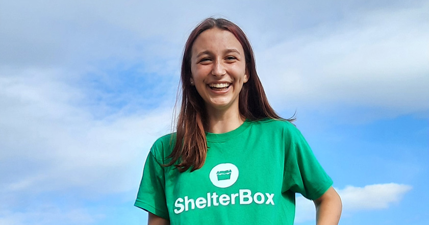 Teenage girl wearing a ShelterBox t-shirt