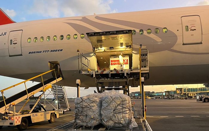 Aid pallets being loaded onto a plane