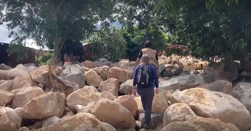 People walking among rocks in Malawi