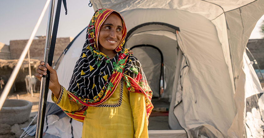 Pakistan woman in front of ShelterBox tent