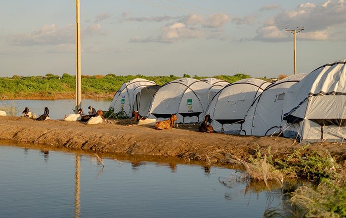 ShelterBox tents next to floodwaters in Pakistan