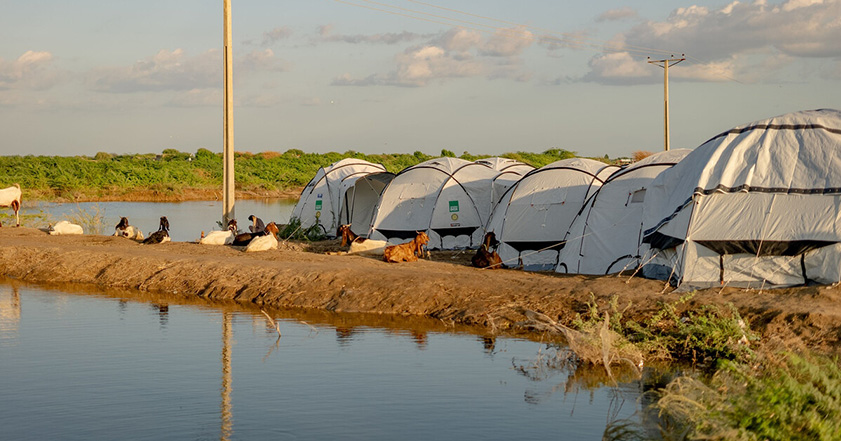 ShelterBox tents next to floodwaters in Pakistan