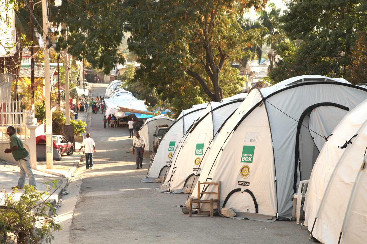 Row of white dome shaped tents in a street in Haiti