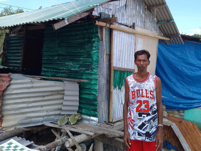 Man outside a shelter in the Philippines