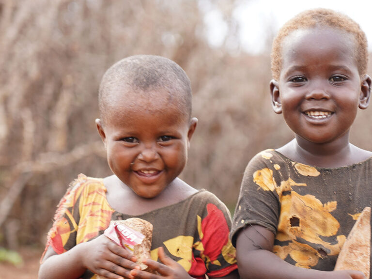 Two small boys smiling in Somalia