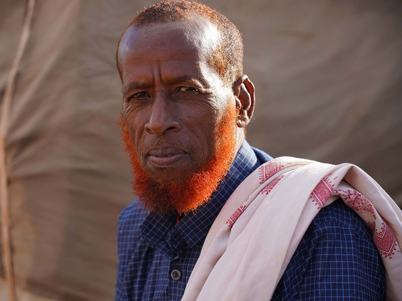 Portrait of a man outside a tent in Somalia