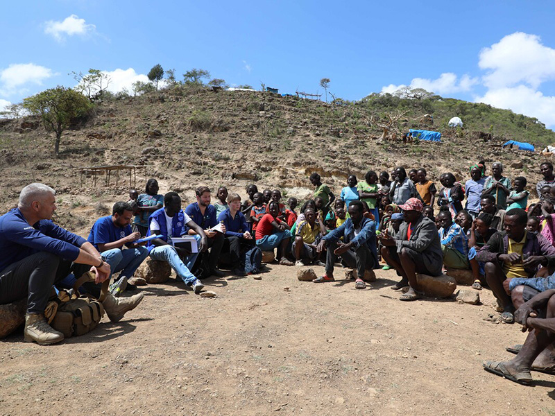 ShelterBox team members and locals talking during a visit to Ethiopia