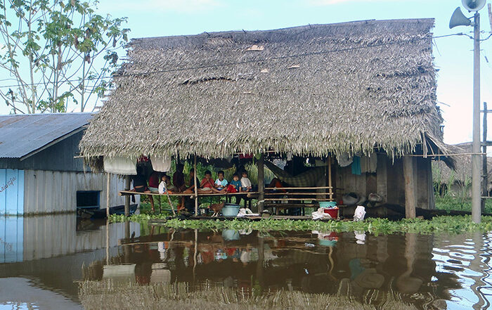 Building next to flood waters in Peru