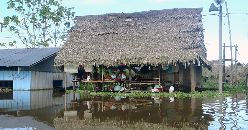 Building next to flood waters in Peru