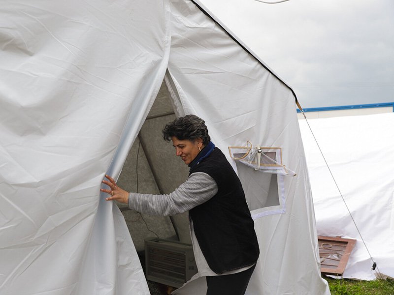 Woman entering a tent