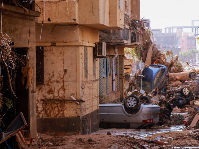 Debris and damaged buildings in a street in Derna in Libya after flooding