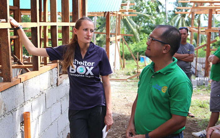 ShelterBox and Rotary team members talking in the Philippines
