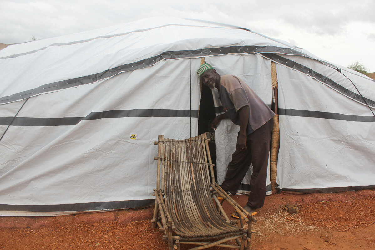 Man outside a Sahelian tent in Burkina Faso