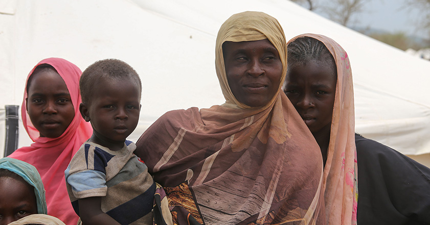 Woman and children outside a tent in Chad