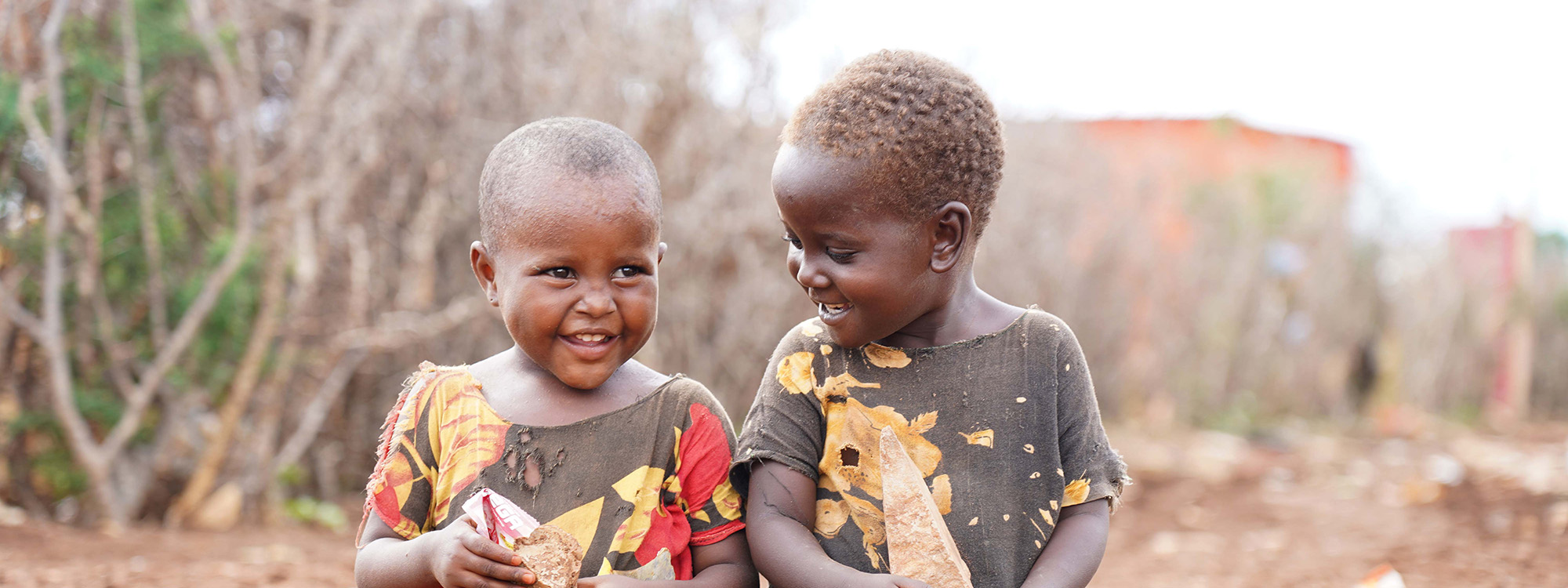 Two young boys smiling in Somalia